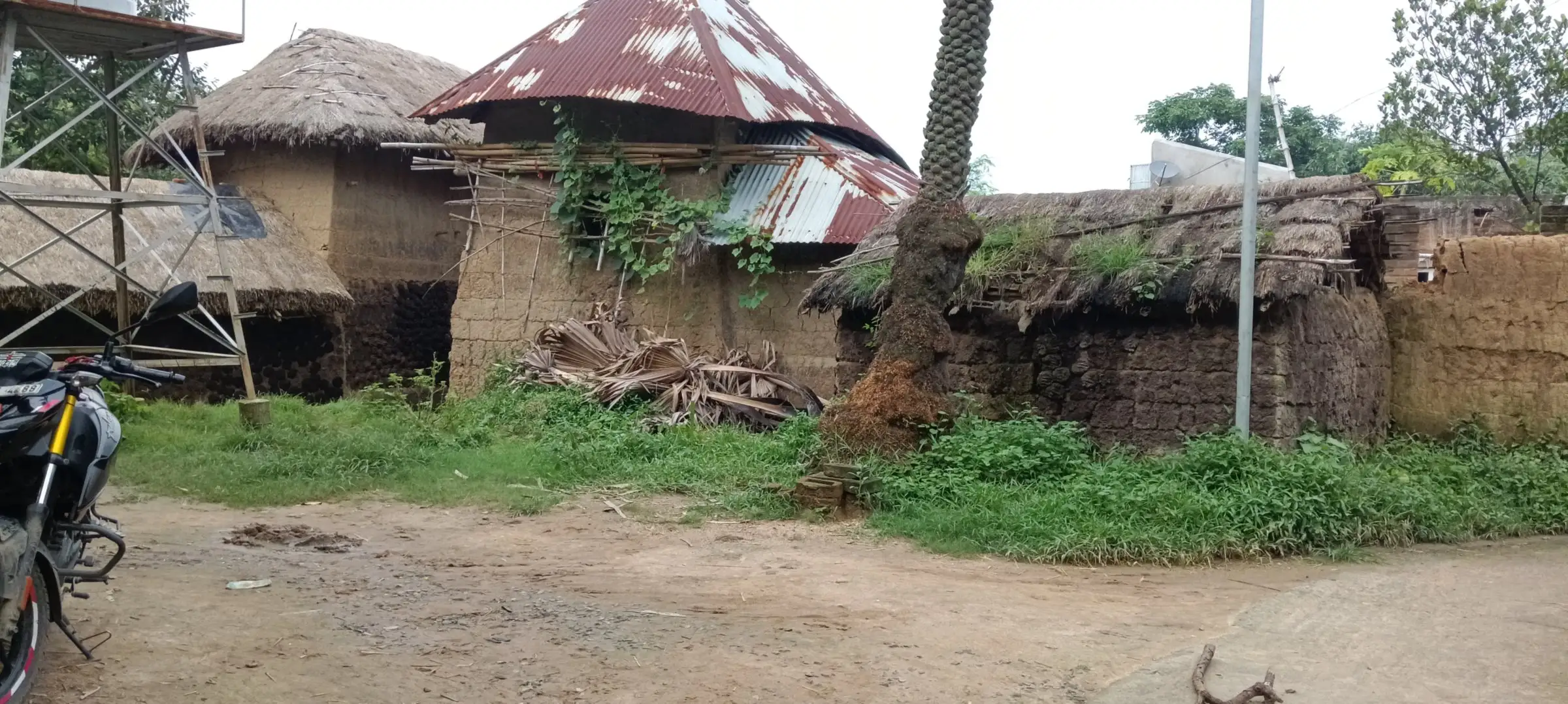 Clearing surrounded by tiled-roof mud houses